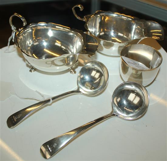 Two similar silver sauce boats with wavy rims, a pair of George V sauce ladles, 1935 & a small tumbler cup